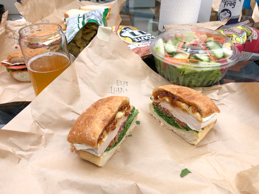 turkey sandwich with brie, tomato jam, and spinach