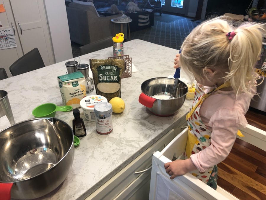 toddler helping make pancakes