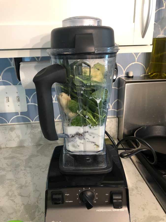 green smoothie with spinach, avocado, milk, chia seeds, banana