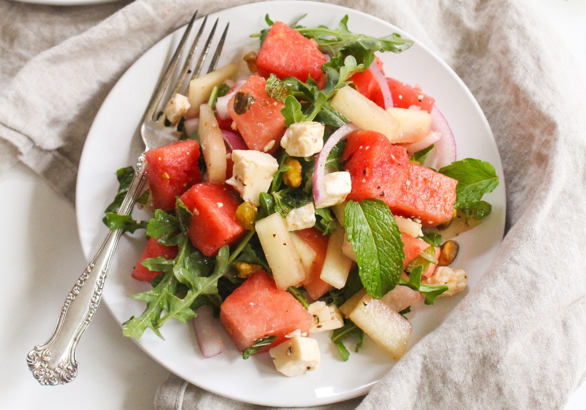 watermelon feta salad with arugula on a plate
