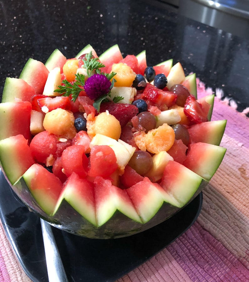 fruit inside a watermelon bowl