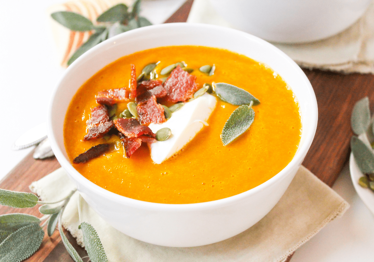 butternut squash soup in a white bowl