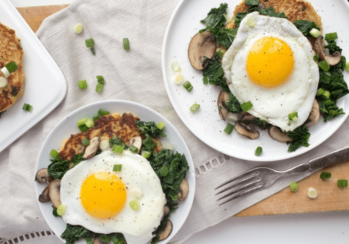 potato pancakes with fried eggs on top