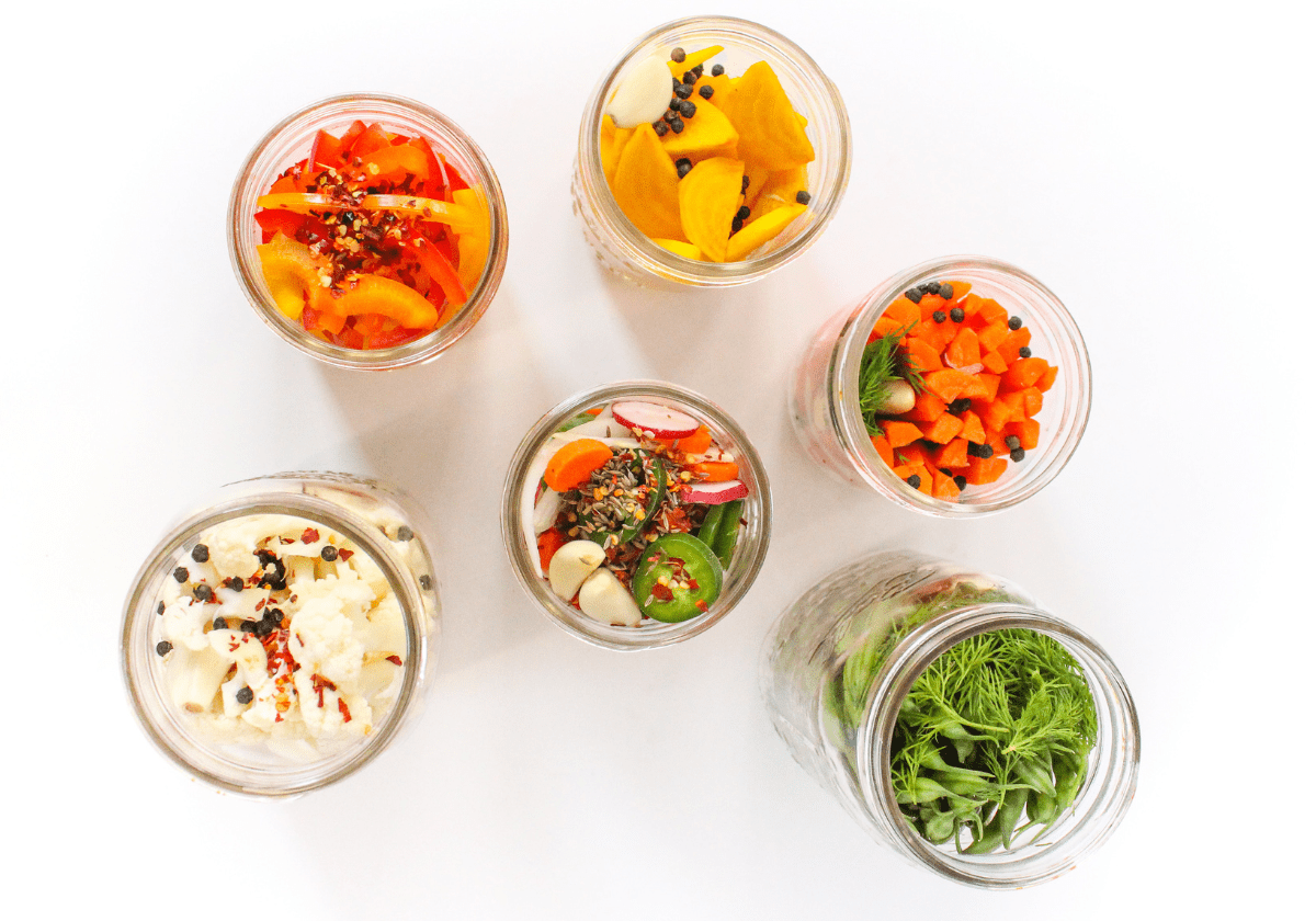 flatlay of fermented vegetables in mason jars