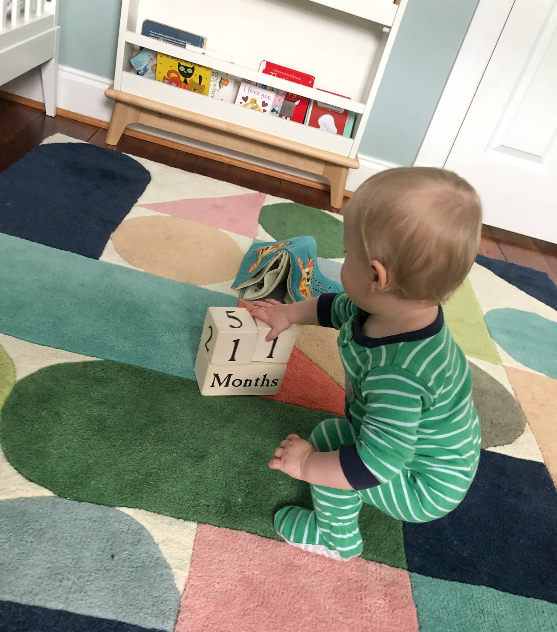 baby with 11 month blocks