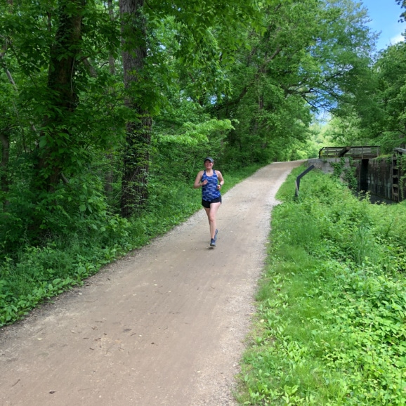 anne mauney running on the c&o canal trail.