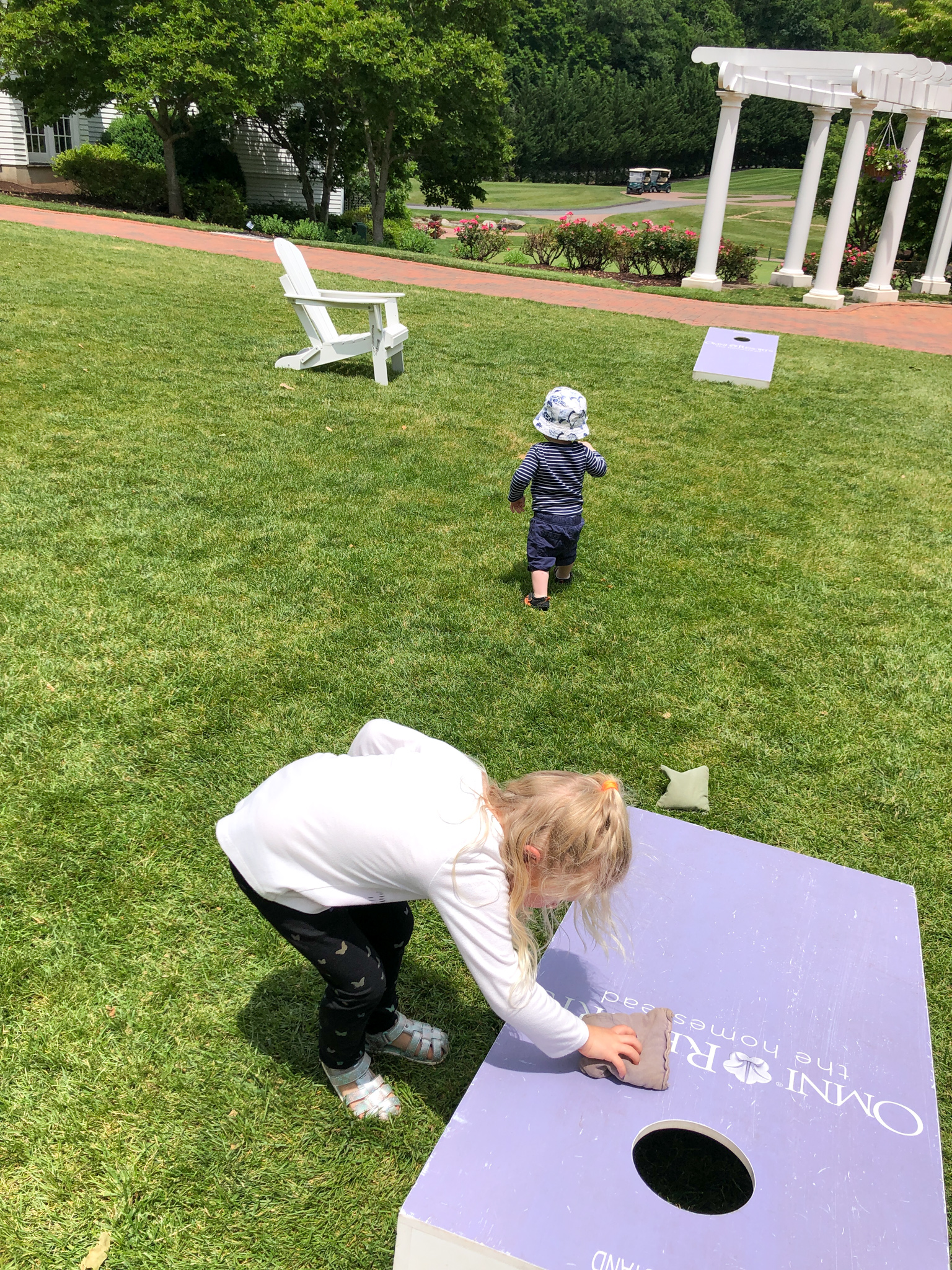 kids playing cornhole