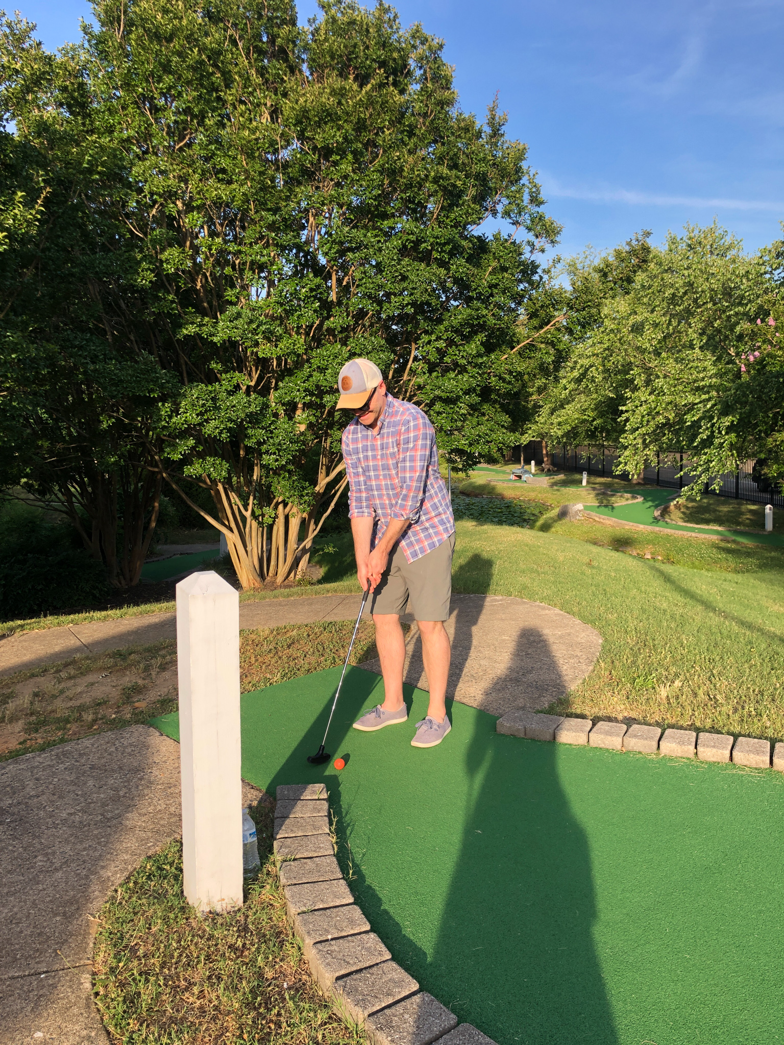 playing mini golf. 