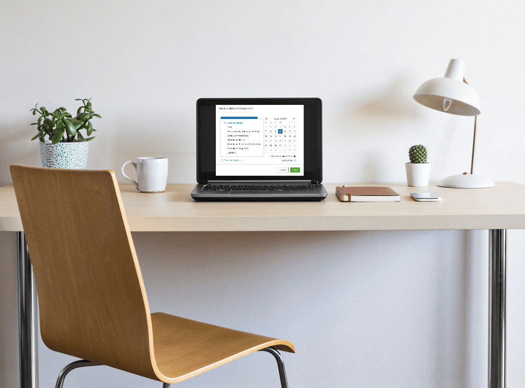 desk with laptop with evernote recurring tasks on screen