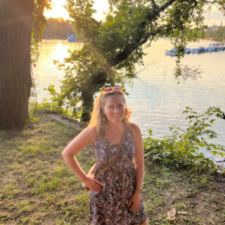 anne mauney by the water in georgetown at sunset