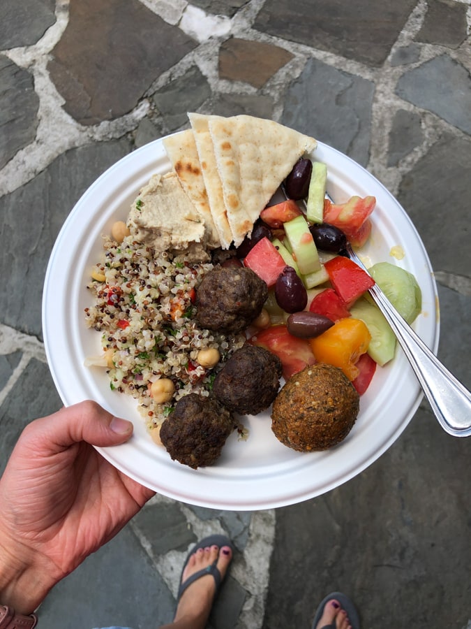 lamb meatballs, quinoa salad, fruit, and pita