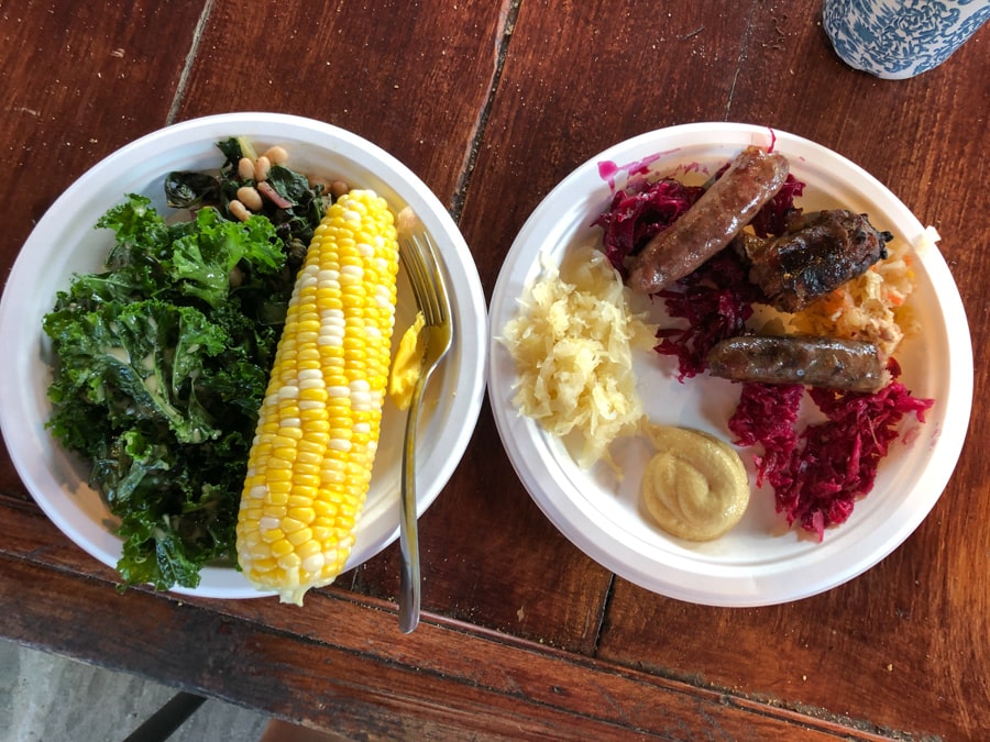 corn, salad, sausage, and sauerkraut