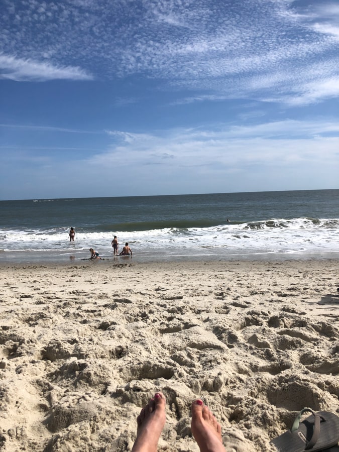 view of feet and the beach in cape may