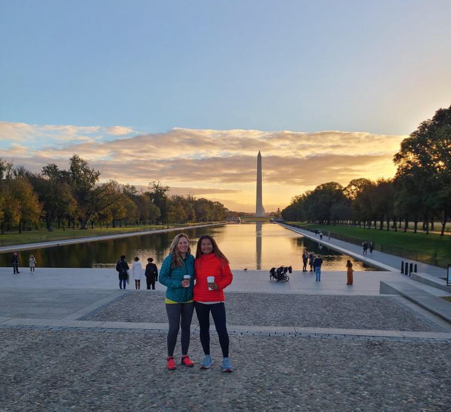 anne mauney and sokphal tun with DC sunrise view