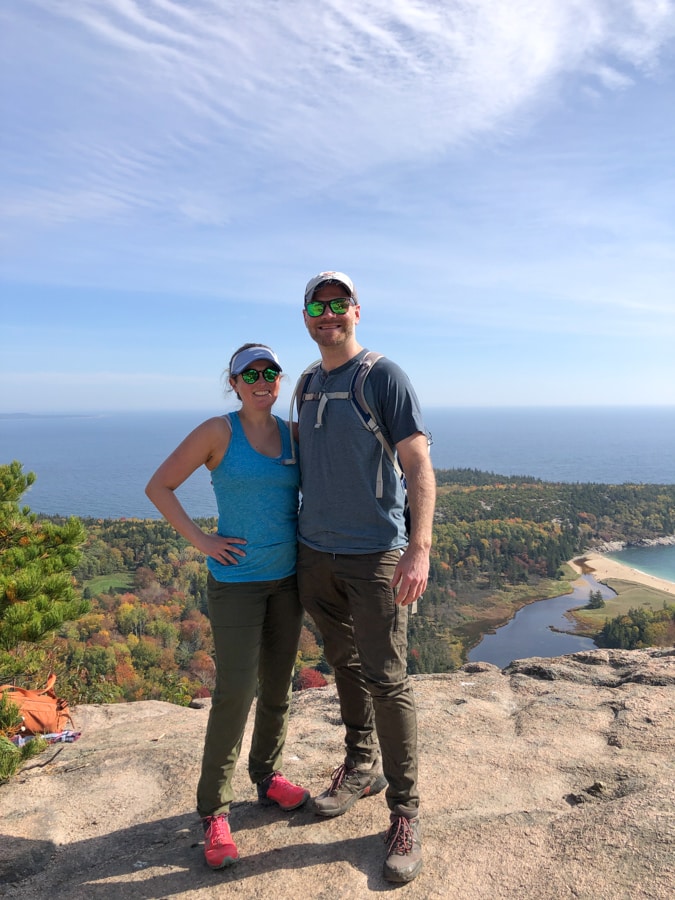 anne and matt mauney at the top of the beehive hike in acadia