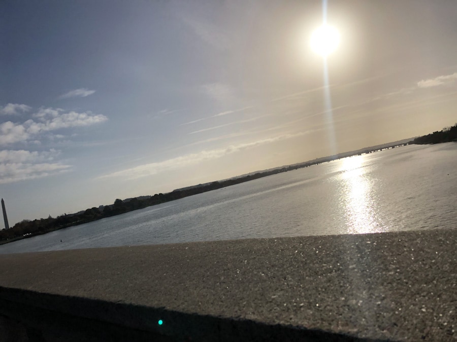 view from memorial bridge of the sun and washington monument