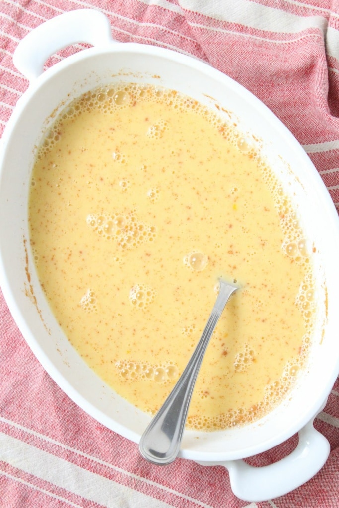 almond milk, egg, and cinnamon mixture in a shallow dish