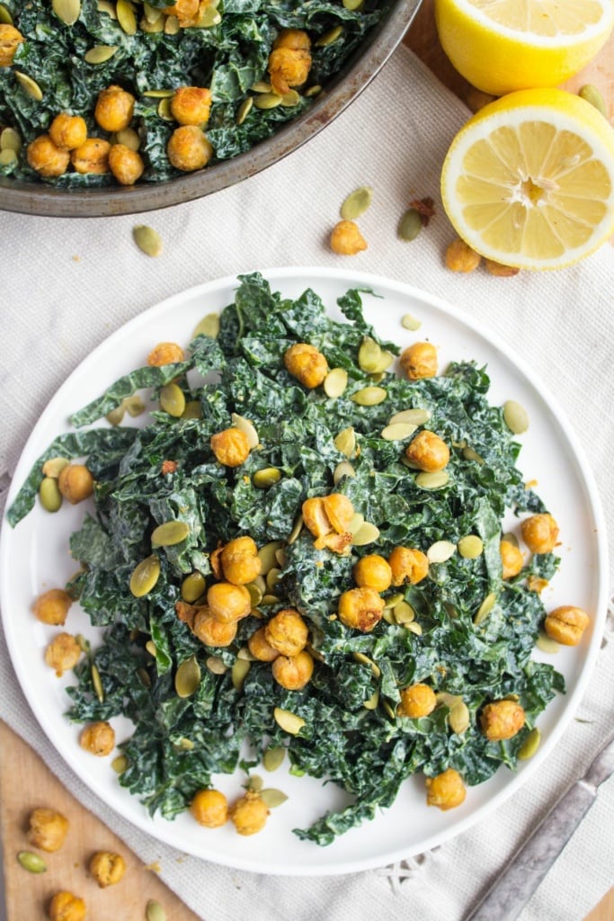 kale caesar salad with vegan dressing and crispy chickpeas on a plate